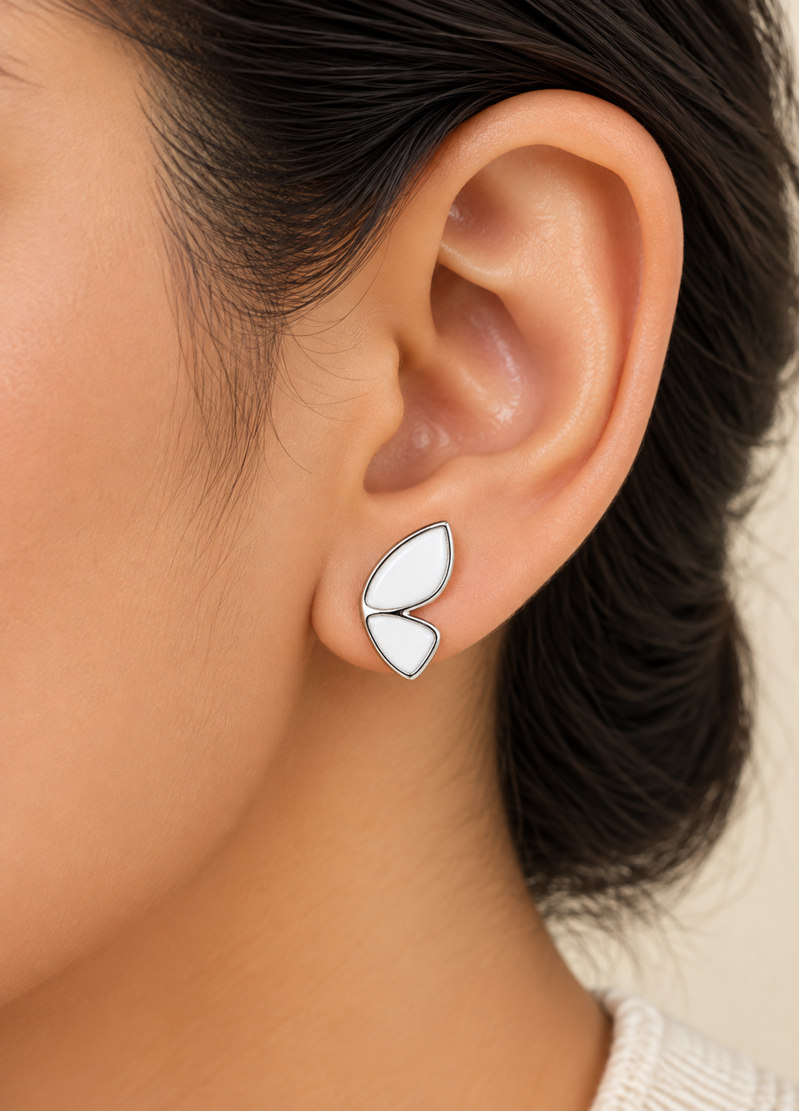 Model wearing Petal Flutter Silver Stud Earrings