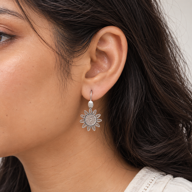 Model wearing Filigree Sunburst Silver Earrings