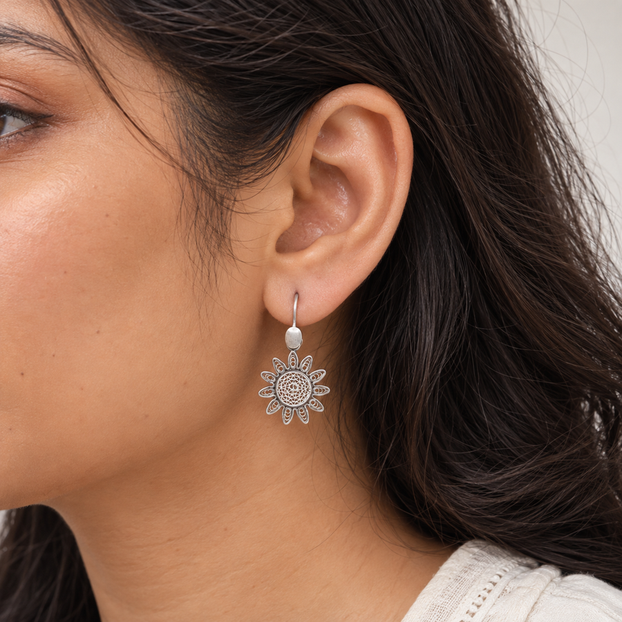 Model wearing Filigree Sunburst Silver Earrings