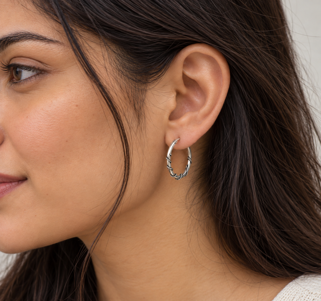 Model wearing Oxidised Twisted Accent Hoop Earrings