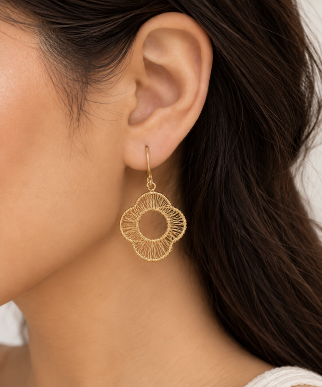 Model wearing Petal Weave Statement Earrings