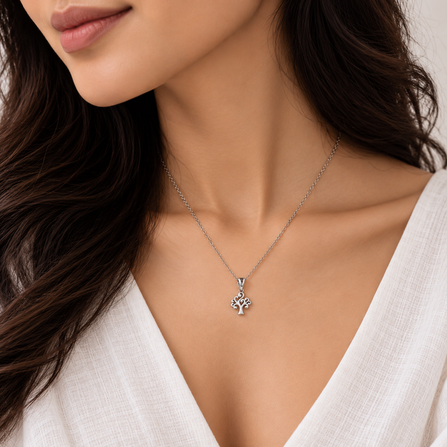 Model wearing Oxidised Silver Tree of Life Pendant