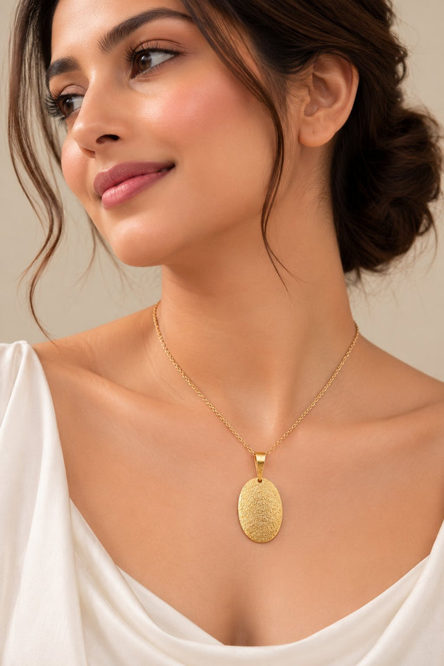 Model wearing Golden Textured Oval Pendant