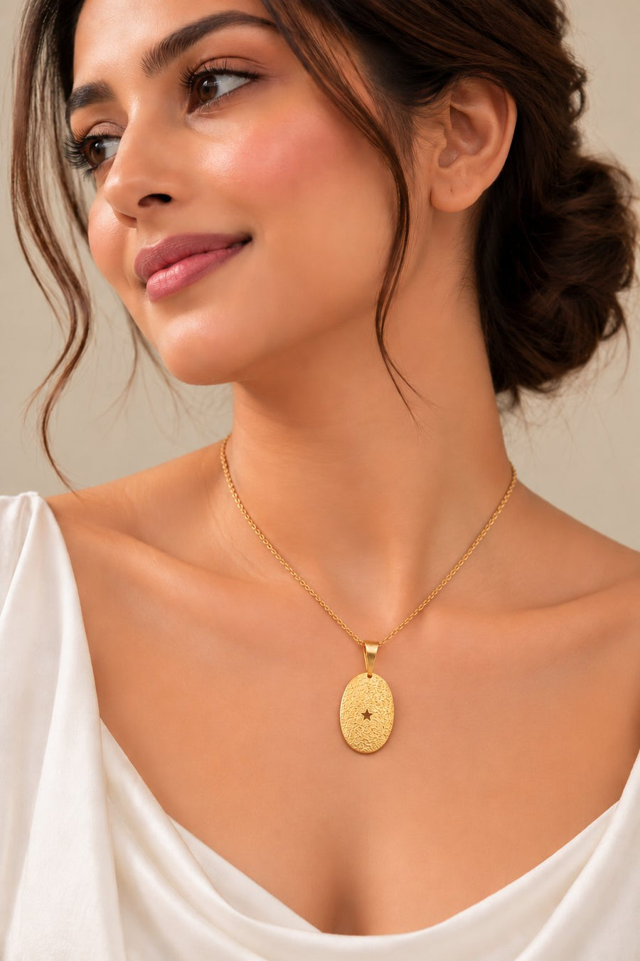 Model wearing the Golden Textured Oval Pendant with star cutout