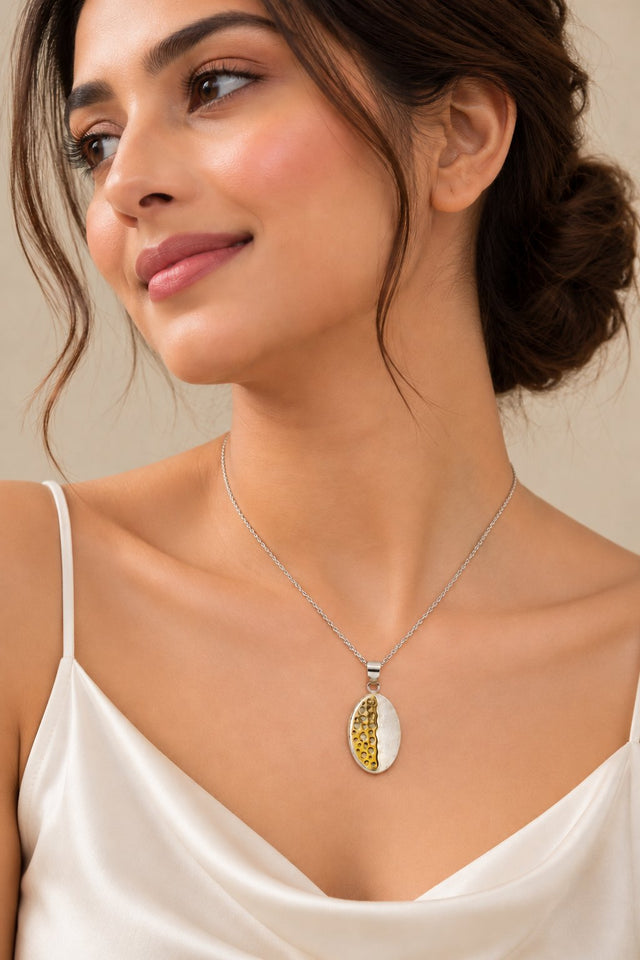 Model wearing Textured Two-Tone Oval Pendant