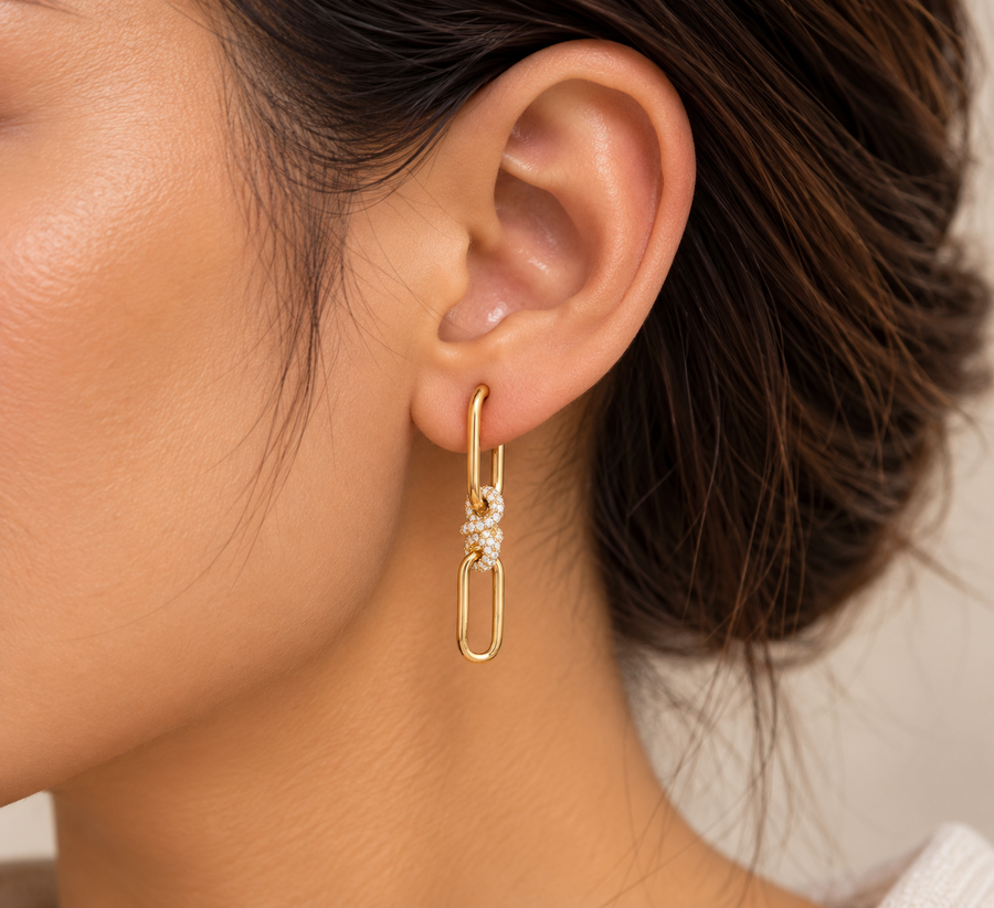 Model wearing Pavé Knot Link Drop Earrings