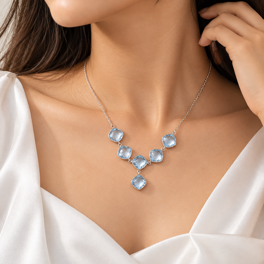 Model wearing Sky Blue Topaz Cascade Necklace